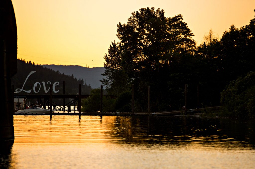 Love sign on a dock at sunset 